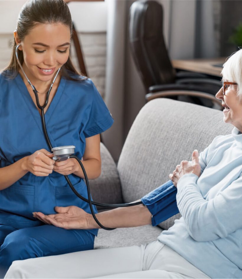 female-nurse-checking-blood-pressure-of-senior-wom-2022-05-31-02-21-30-utc